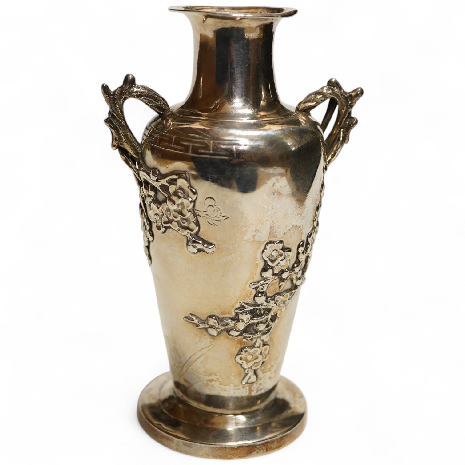 A Chinese export silver twin handed vase c.1900, stamped KC, artisans mark, decorated in relief with flowering prunus branches, height 13cm., weight approx. 4.72ozt
